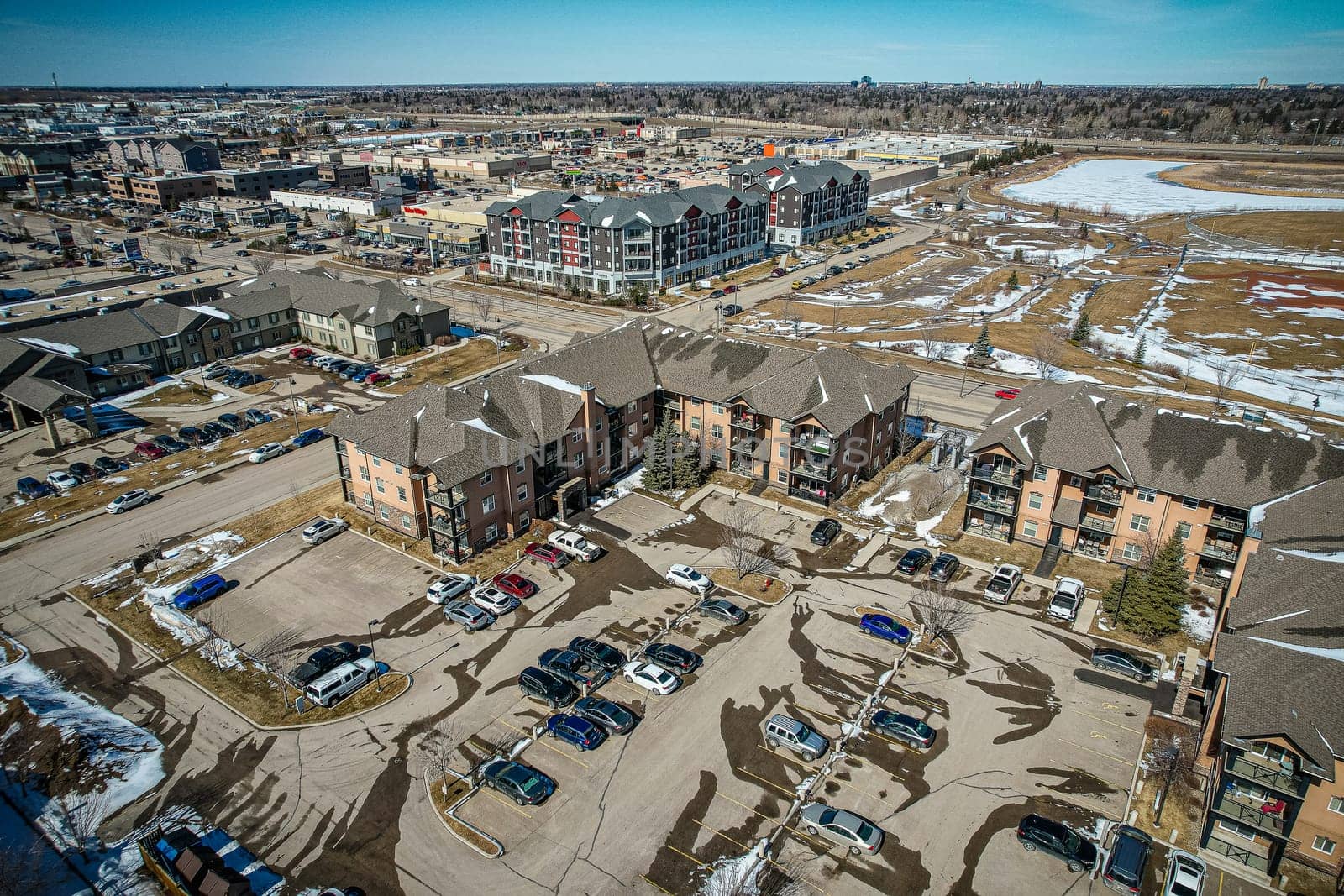 Captivating aerial shot of Stonebridge in Saskatoon, highlighting the harmonious blend of modern architecture and Saskatchewan's verdant surroundings.