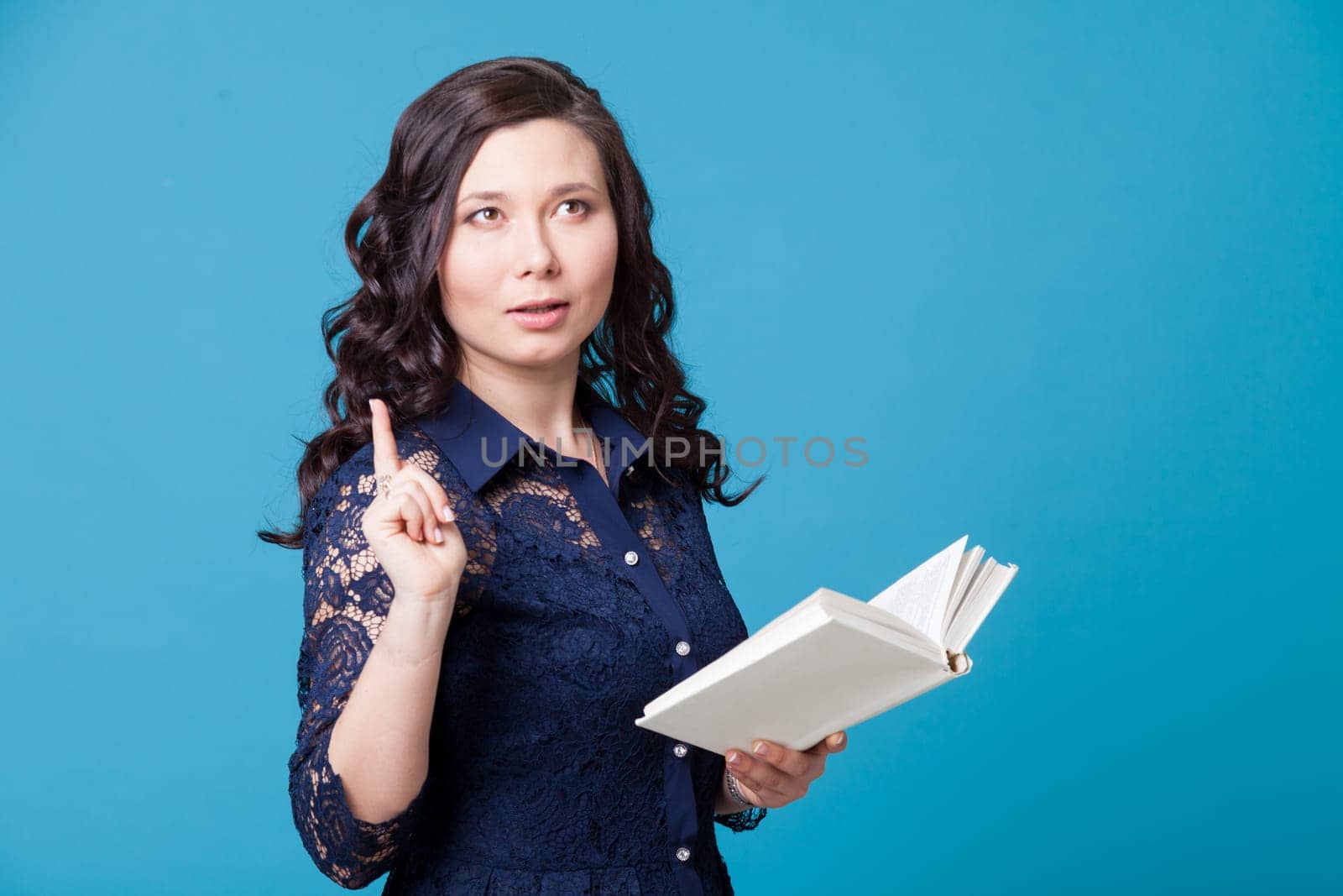 Portrait of a Asian woman reads a book on a blue background by Simakov