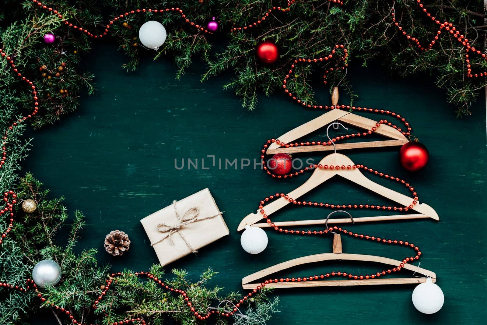 hangers from the wardrobe of clothes on Christmas new year tree by Simakov