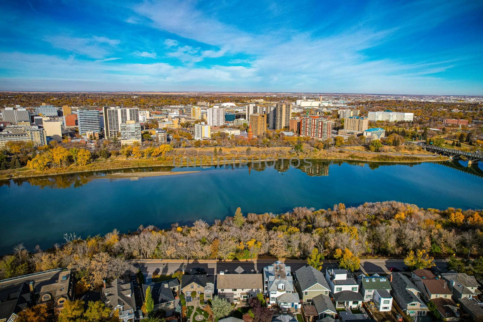 Aerial spectacle of downtown Saskatoon, revealing the city's architectural marvels, bustling streets, and the pulsating core of Saskatchewan's metropolis