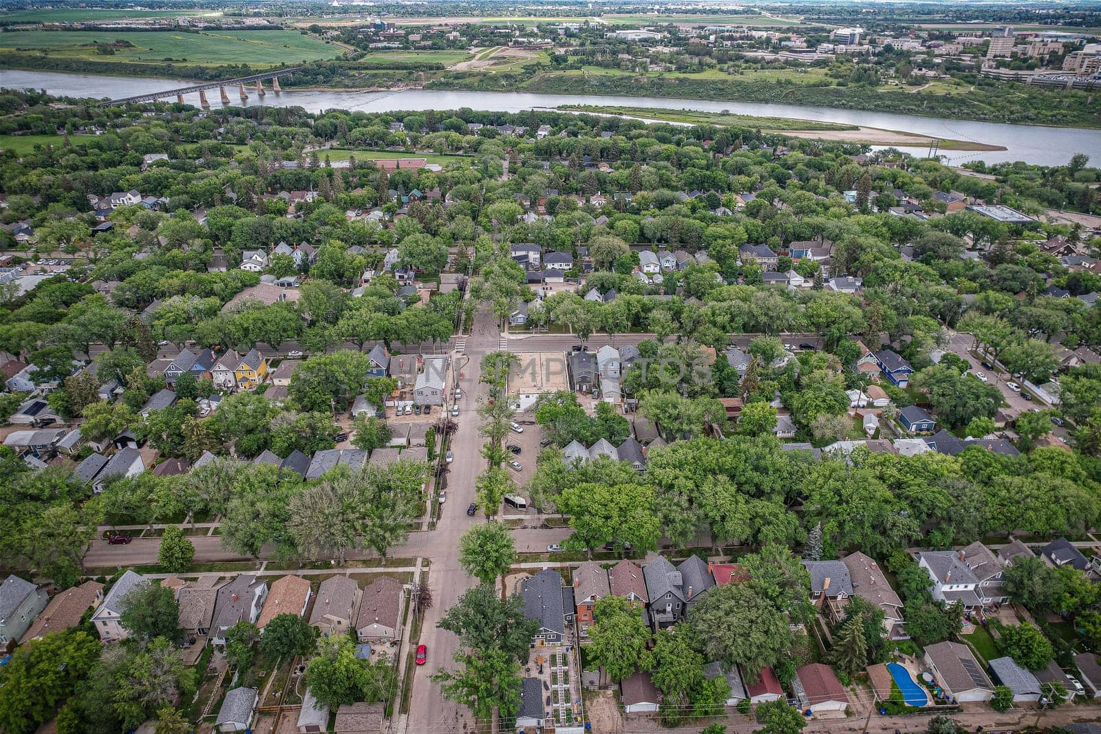 Aerial view of City Park which is a mixed-use neighbourhood located near the center of Saskatoon, Saskatchewan, Canada. It comprises a mix of single-family detached homes, apartment buildings and other semi-detached dwellings