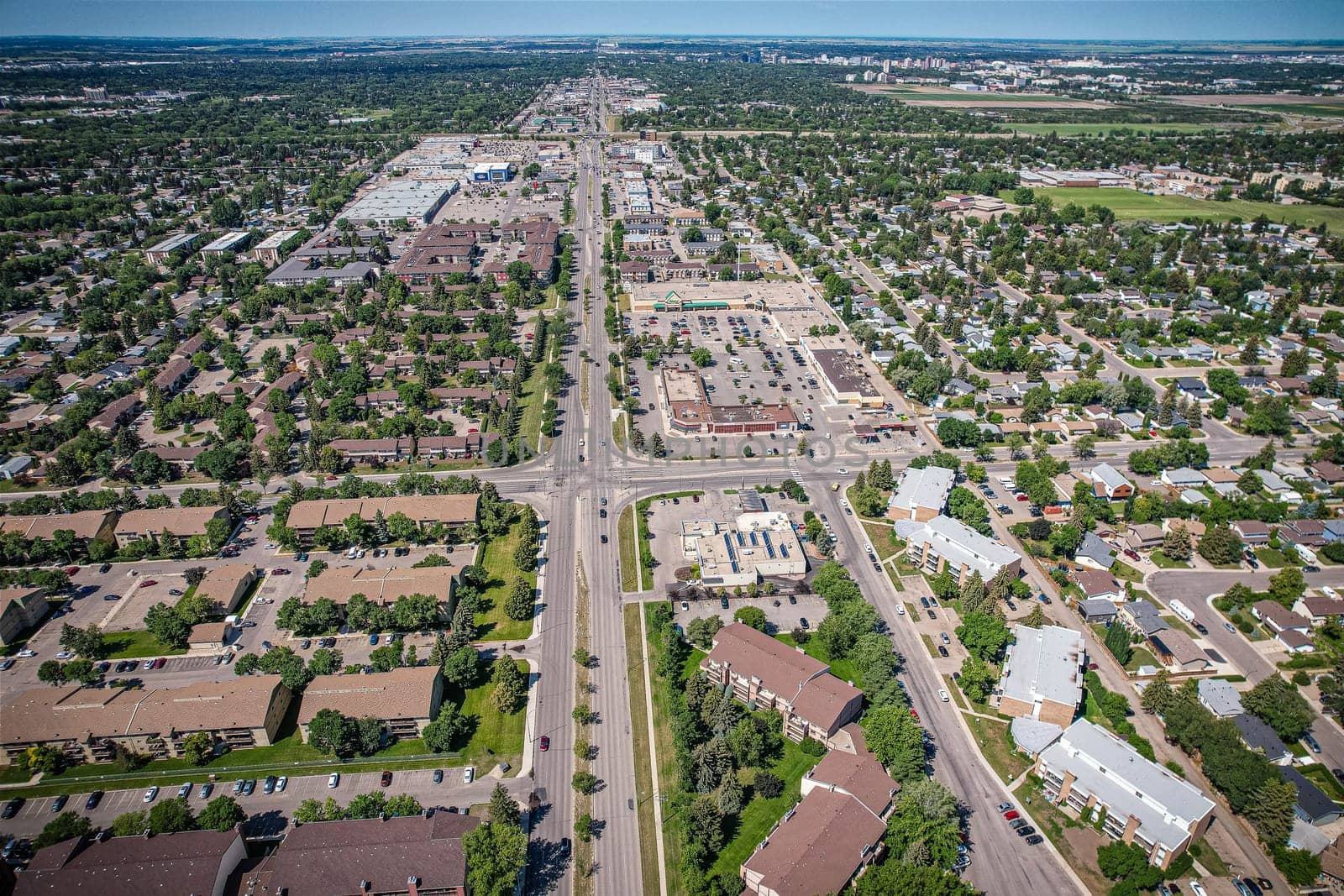 Aerial View of 8th Street East which is a main arterial road serving the city of Saskatoon, Saskatchewan. It begins as a continuation of a minor residential street at Lorne Avenue in Saskatoon, and runs through the eastern part of city, eventually exiting the city limits as a country road.