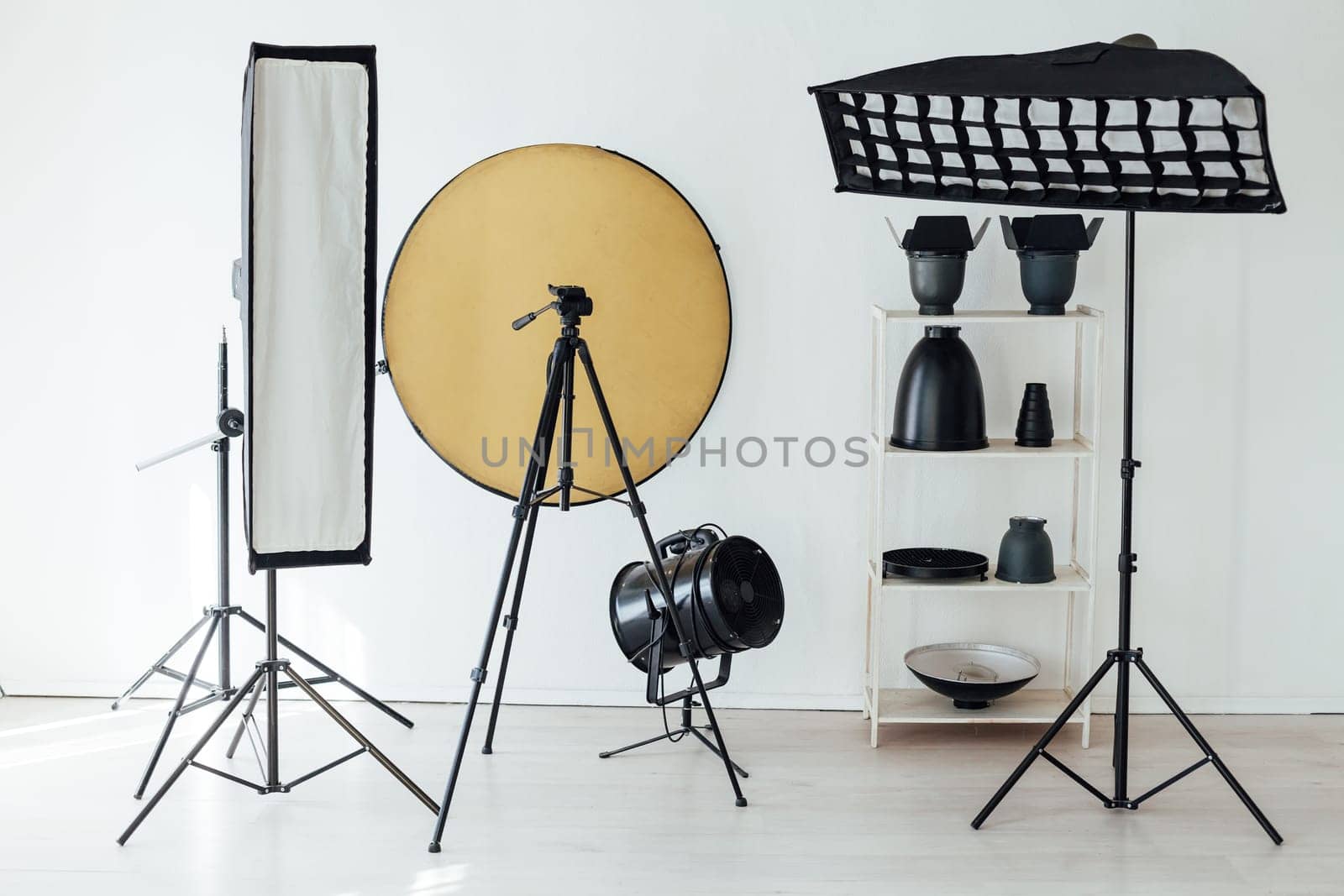 Photo studio accessories photographer flash white room by Simakov