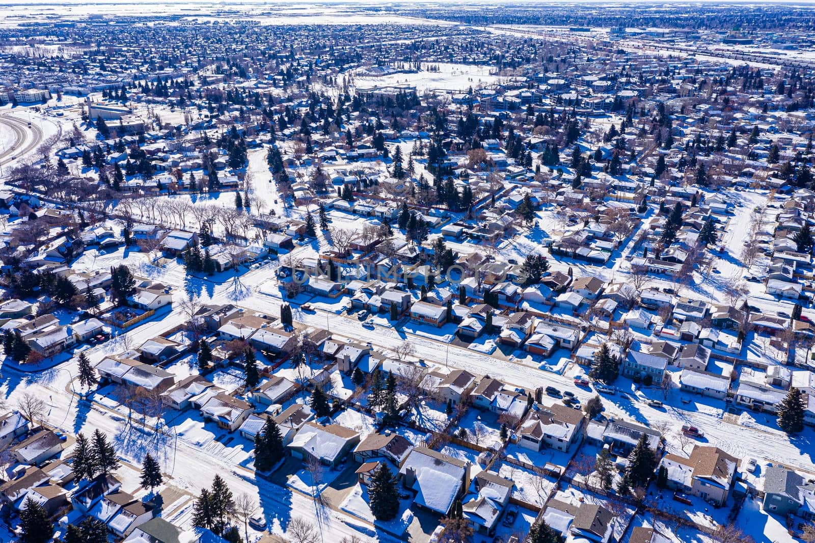 Explore the lush Forest Grove neighborhood in Saskatoon from an aerial perspective. This drone image captures the area's verdant charm, peaceful streets, and community warmth, under the vast Saskatchewan sky.