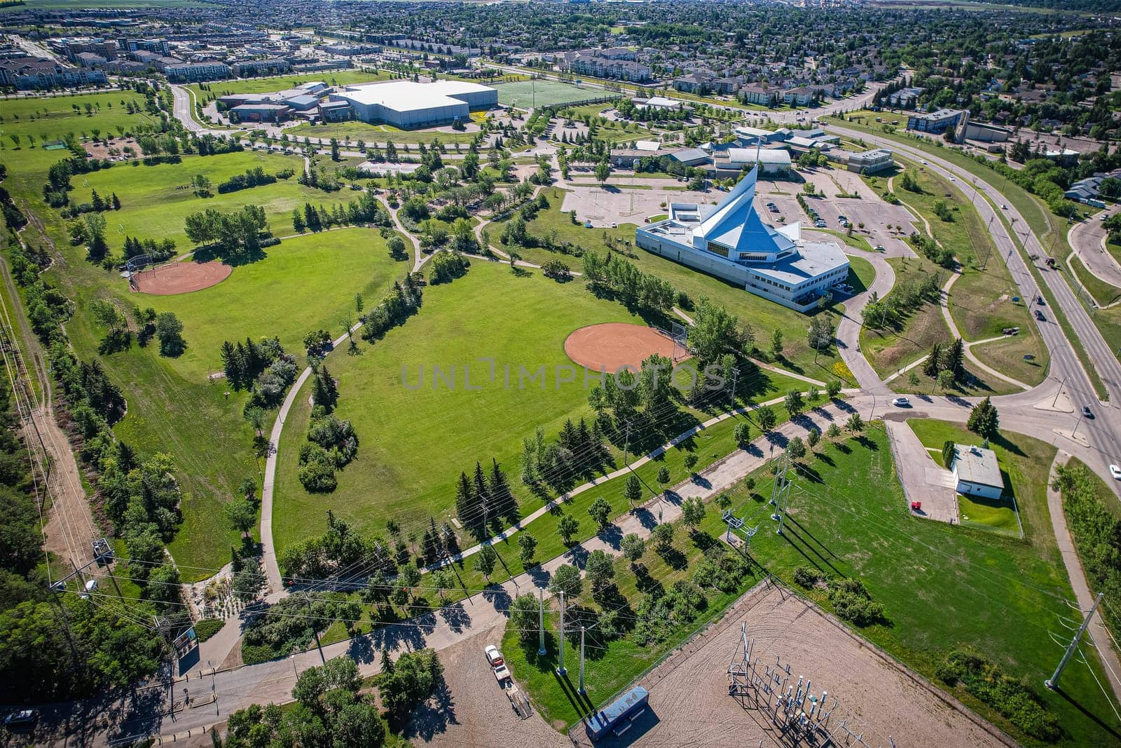 Aerial journey over Silverspring in Saskatoon, revealing a harmonious blend of suburban life, green expanses, and the distinct charm of Saskatchewan's landscapes.