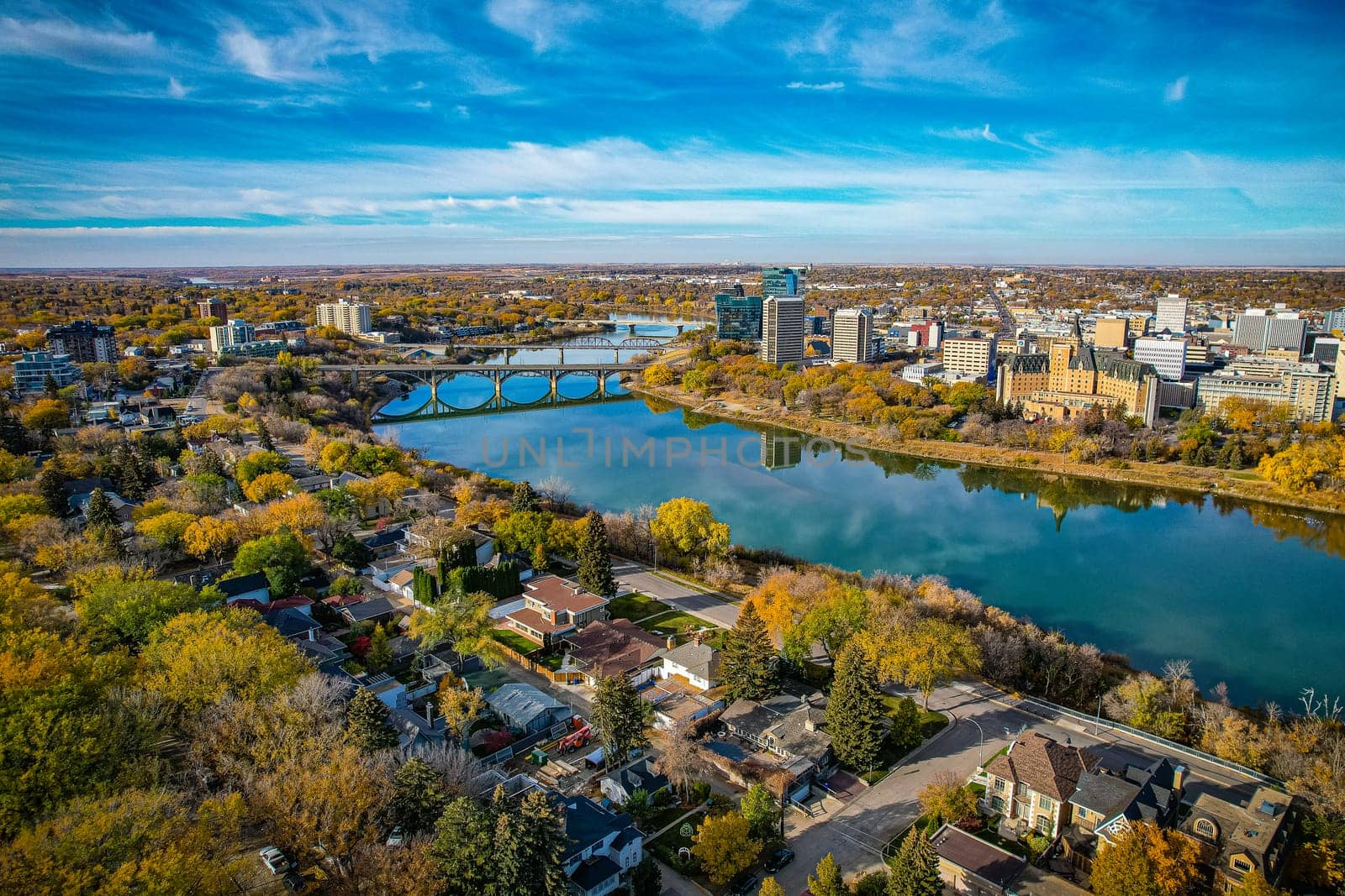 Aerial spectacle of downtown Saskatoon, revealing the city's architectural marvels, bustling streets, and the pulsating core of Saskatchewan's metropolis