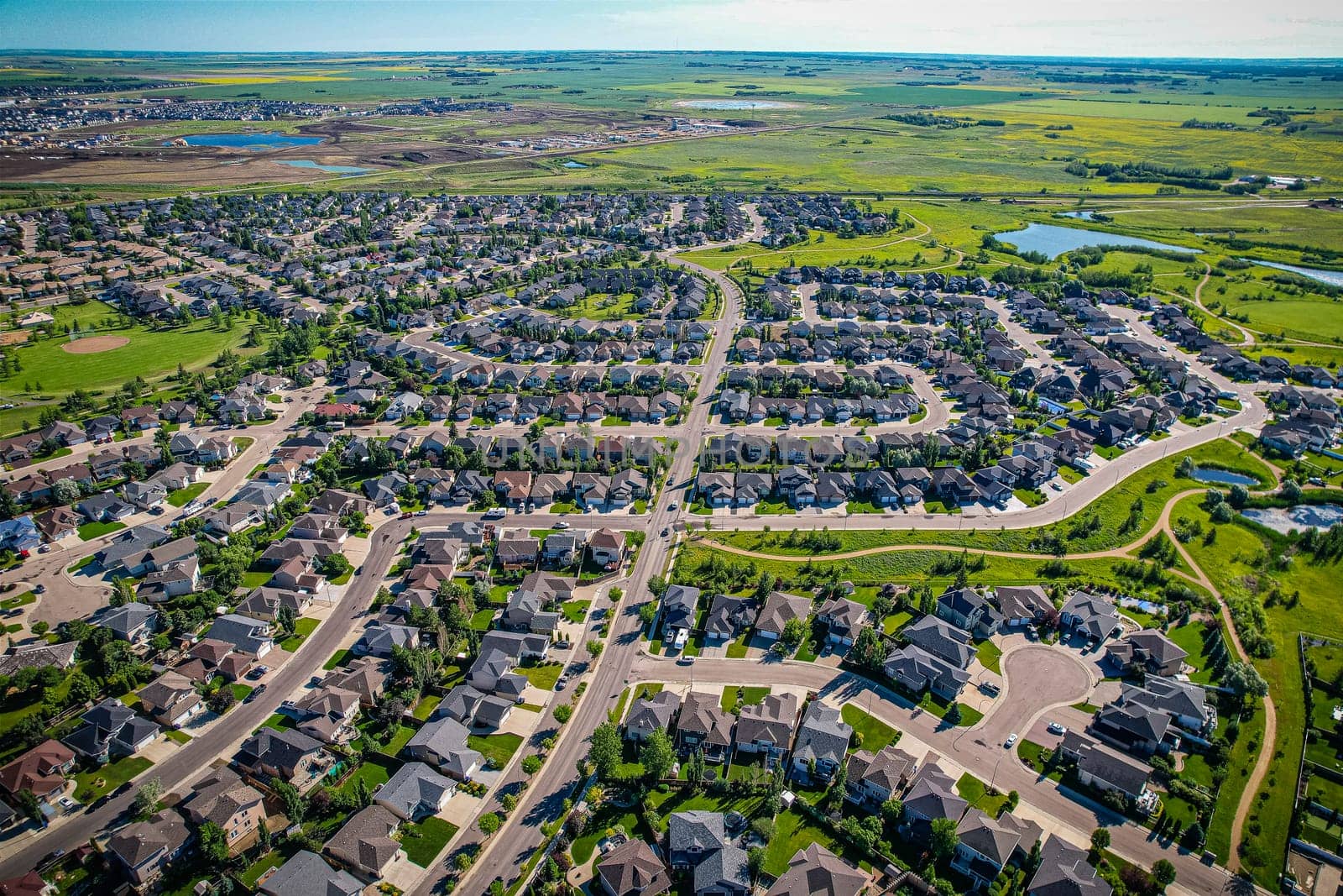 Aerial view of Briarwood which is a residential neighbourhood located in the southeast part of Saskatoon, Saskatchewan, Canada. The majority of its residents live in low-density, single detached dwellings.