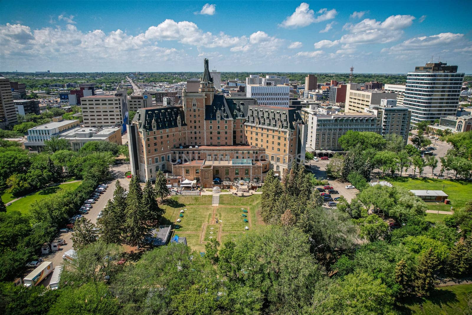 Aerial spectacle of downtown Saskatoon, revealing the city's architectural marvels, bustling streets, and the pulsating core of Saskatchewan's metropolis