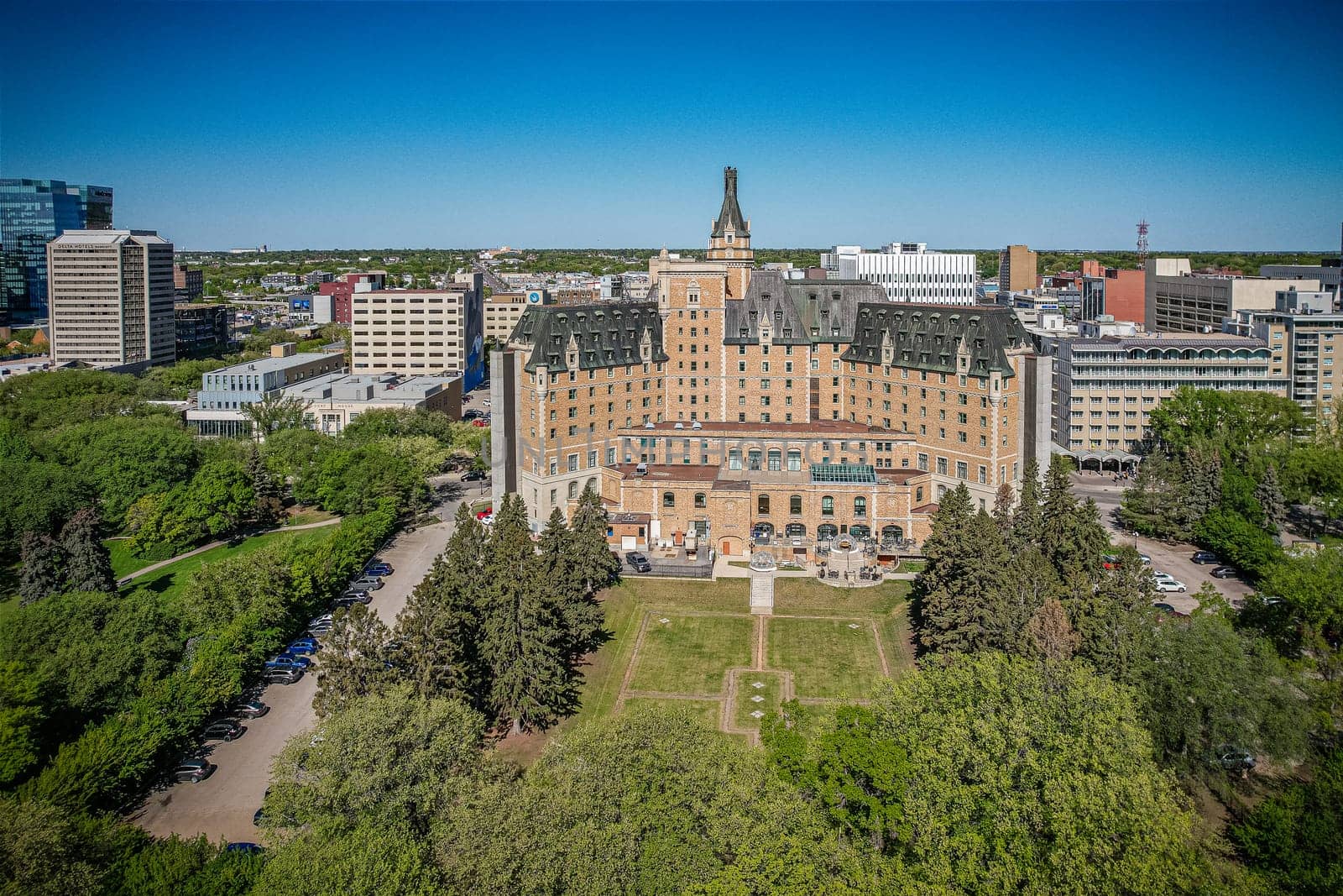 Aerial spectacle of downtown Saskatoon, revealing the city's architectural marvels, bustling streets, and the pulsating core of Saskatchewan's metropolis