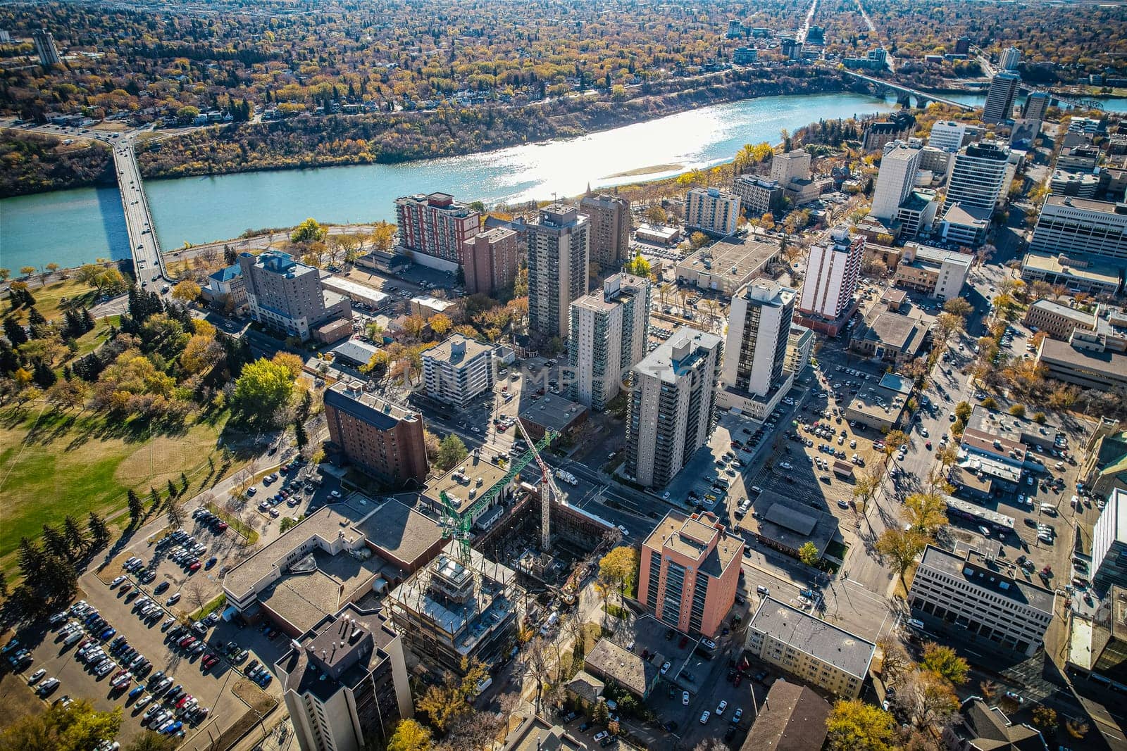Aerial spectacle of downtown Saskatoon, revealing the city's architectural marvels, bustling streets, and the pulsating core of Saskatchewan's metropolis