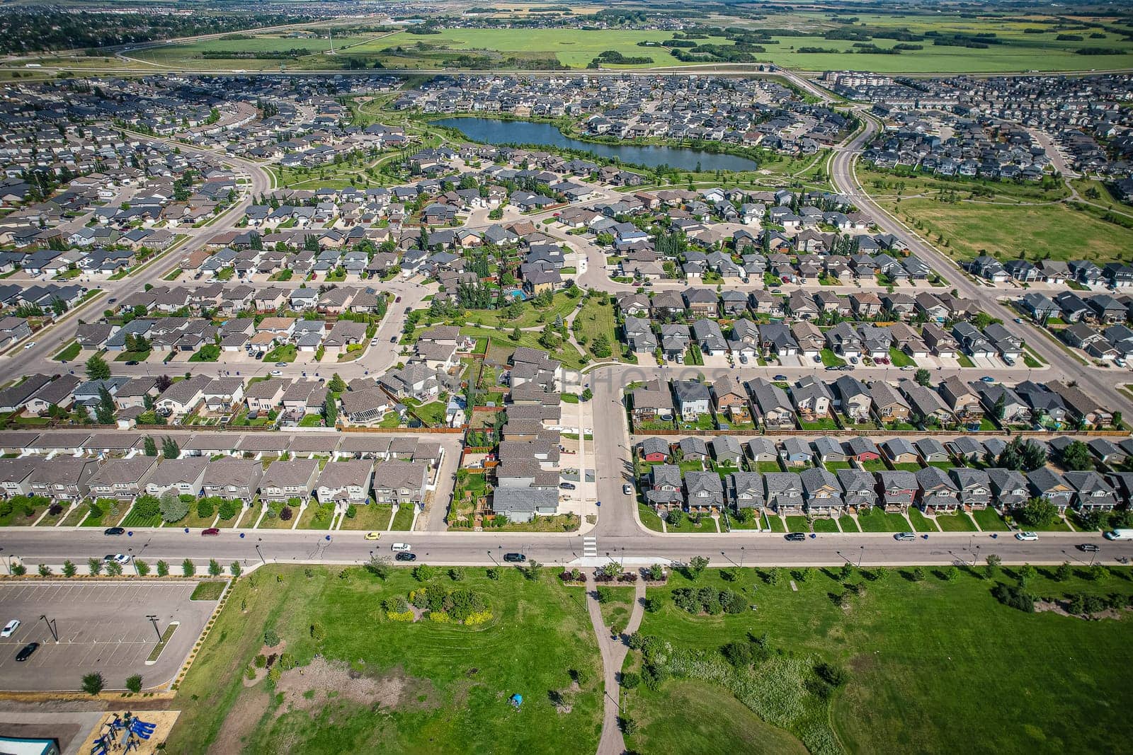 Captivating aerial shot of Stonebridge in Saskatoon, highlighting the harmonious blend of modern architecture and Saskatchewan's verdant surroundings.