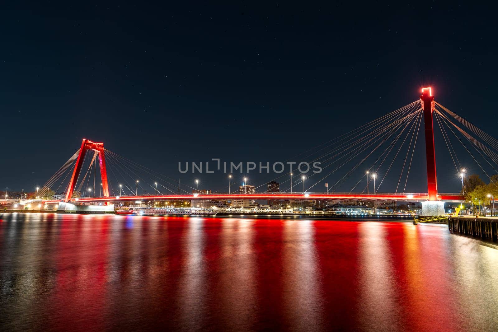 Stunning Night View of Willemsbrug Bridge in Rotterdam with Spectacular Long Exposure Light Trails by PhotoTime