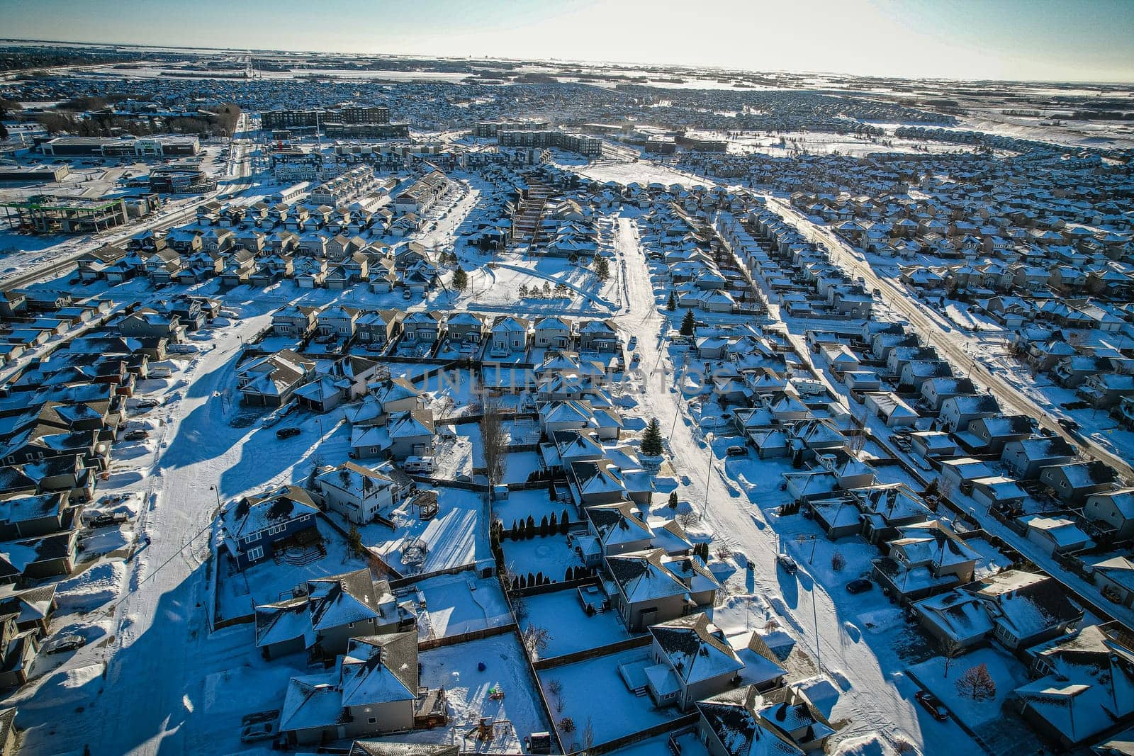 Captivating aerial shot of Stonebridge in Saskatoon, highlighting the harmonious blend of modern architecture and Saskatchewan's verdant surroundings.