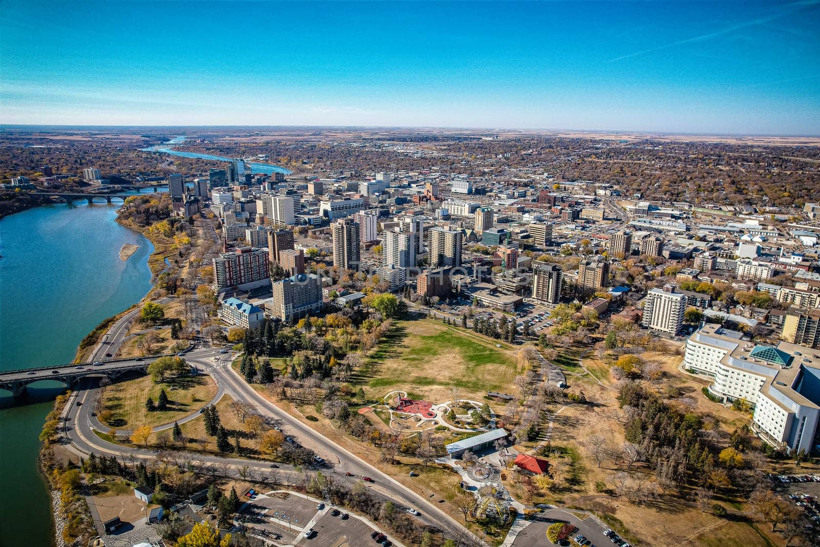 Aerial spectacle of downtown Saskatoon, revealing the city's architectural marvels, bustling streets, and the pulsating core of Saskatchewan's metropolis