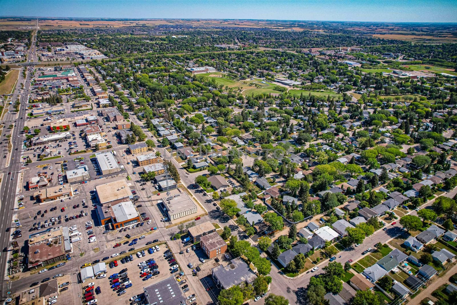 Aerial view of Brevoort Park which is a primarily residential neighbourhood located in the southeast part of Saskatoon, Saskatchewan, Canada. It includes part of the 8th Street business district. Just over half of its dwellings are single detached houses, with a sizeable minority of duplex or apartment-style multiple unit dwellings