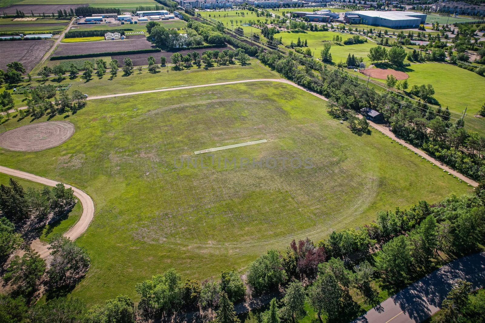 Aerial journey over Silverspring in Saskatoon, revealing a harmonious blend of suburban life, green expanses, and the distinct charm of Saskatchewan's landscapes.