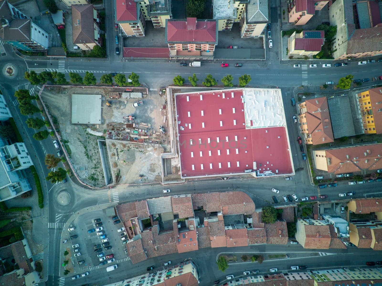 aerial view drone shot of grocery supermarket construction site in Cremona, Italy