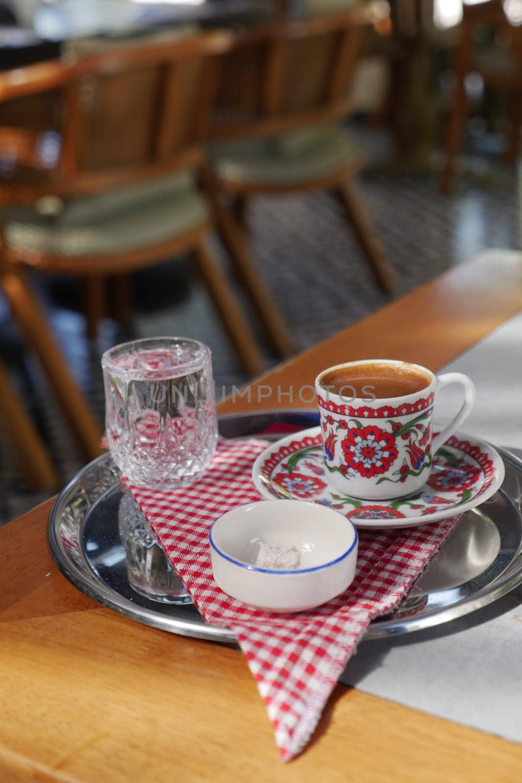 a cup of turkish coffee on table .