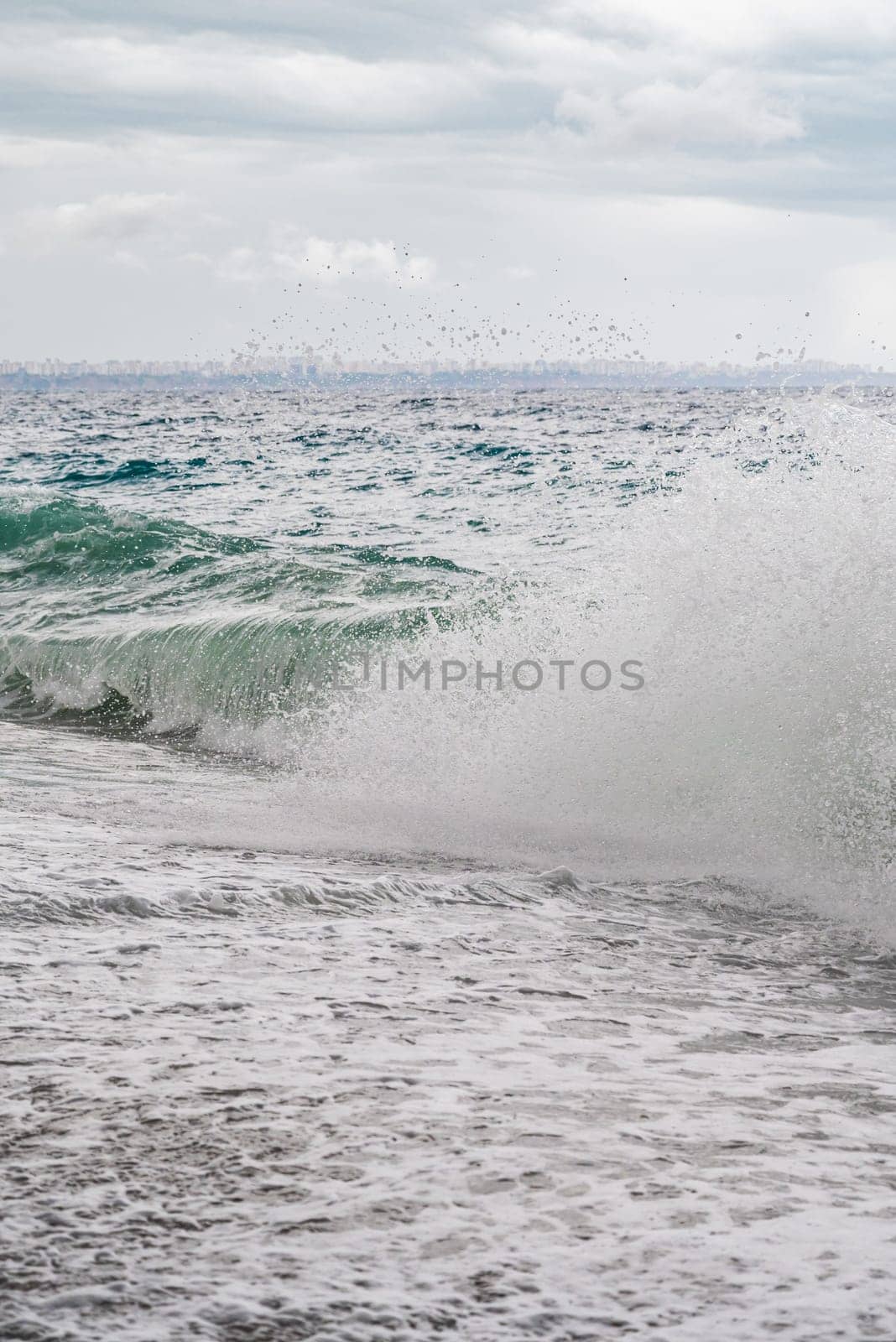 big waves hitting the Konyaalti coast on a stormy day by Sonat