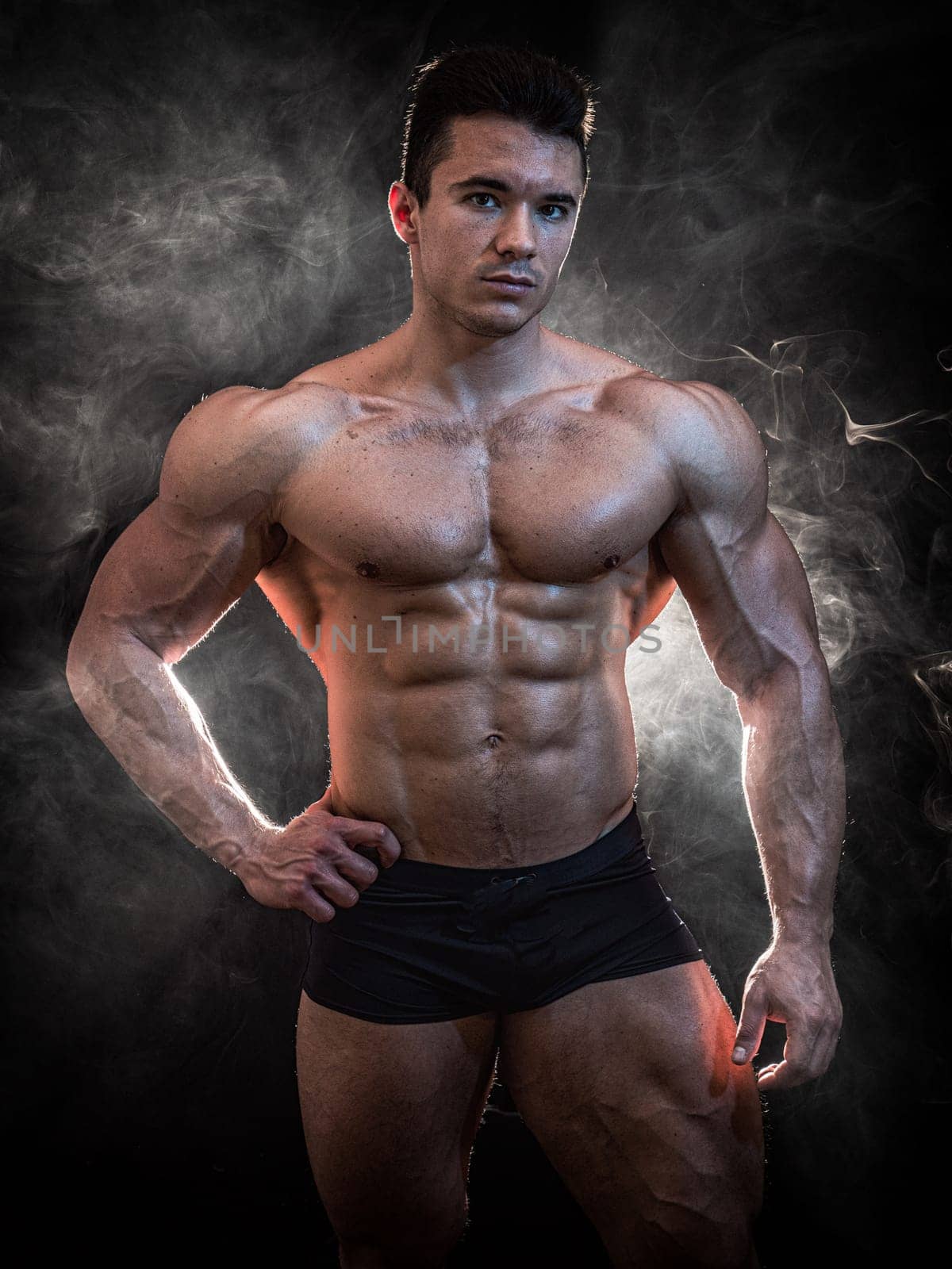 A Strong Display of Masculinity: Flexing Muscles and Striking a Pose by artofphoto