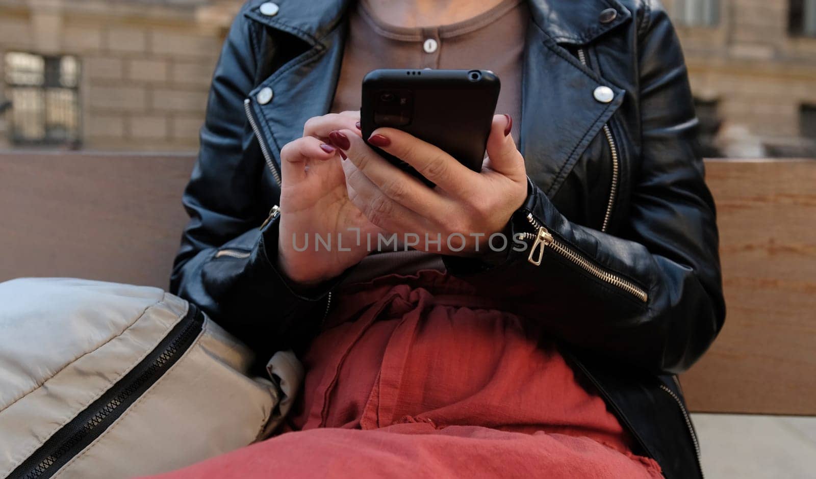 Beautiful Woman Texting On City Street by GekaSkr