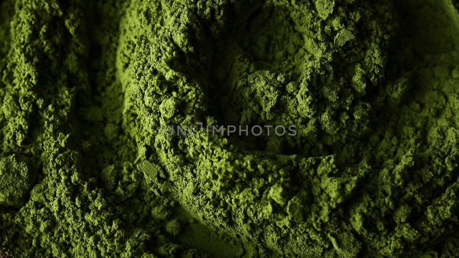 Matcha green tea powder close up top view