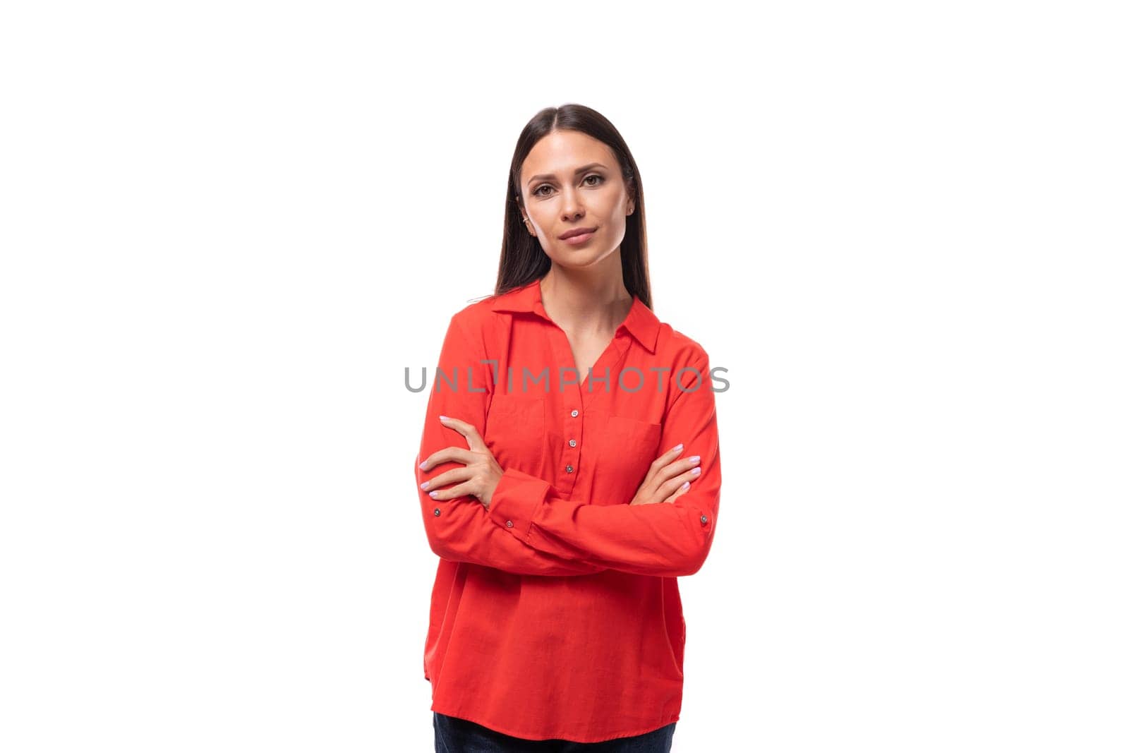 pretty young business woman with black hair dressed in a red shirt on a white background with copy space by TRMK