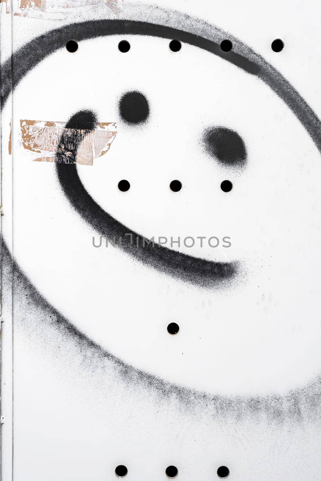 Wall with black smiley, background for many uses.