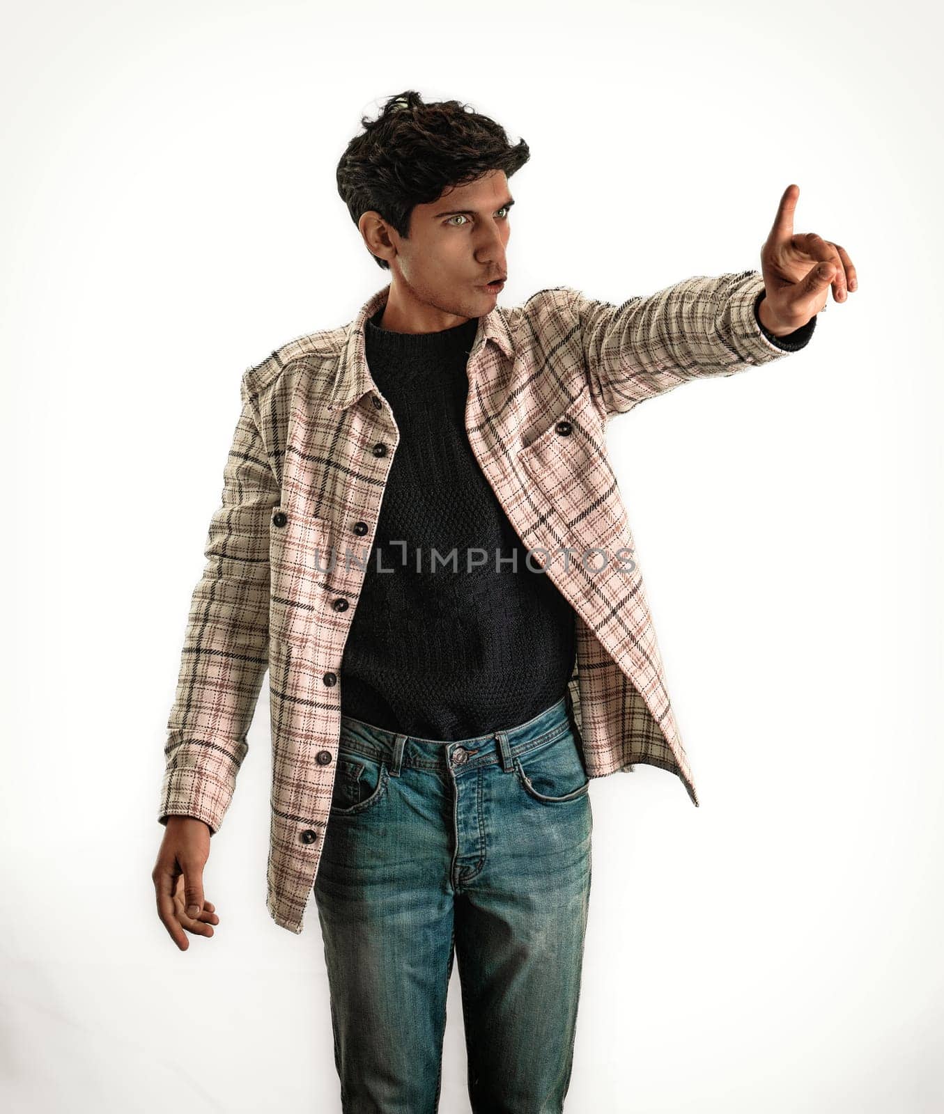 A man in a plaid jacket saying No with a hand gesture, in studio shot on white background