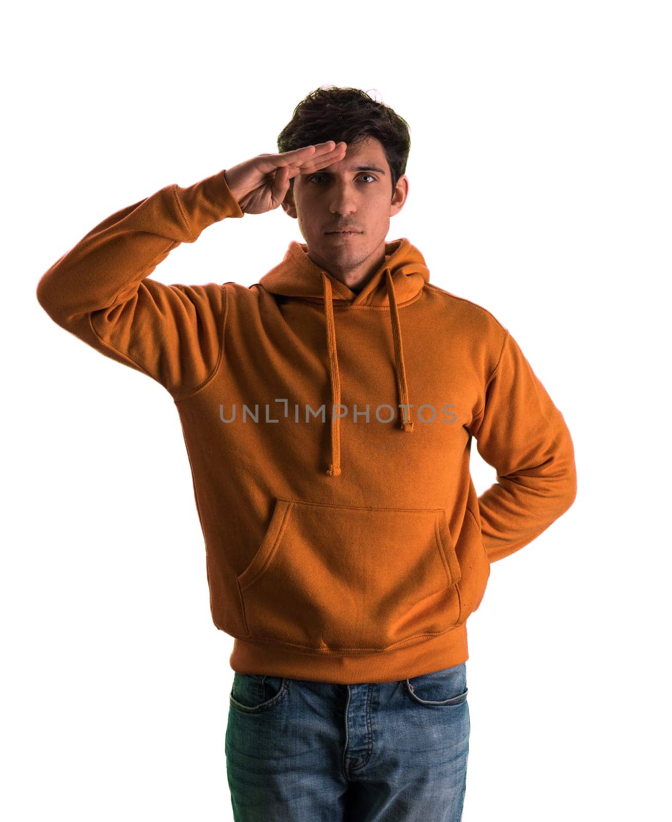 A man in an orange hoodie is standing at attention, with hand on his forehead by artofphoto