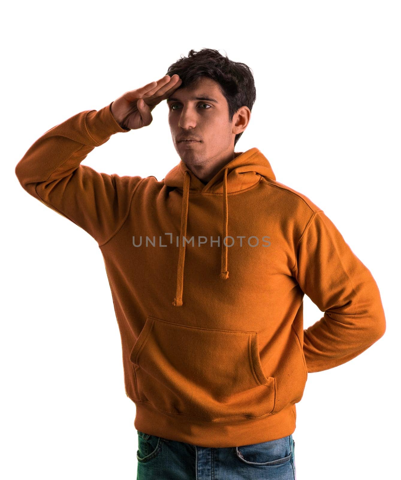 A man in an orange hoodie is standing at attention, with hand on his forehead by artofphoto