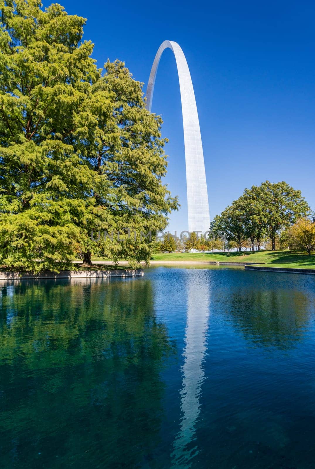 Gateway Arch of St Louis Missouri reflecting in the lake by steheap