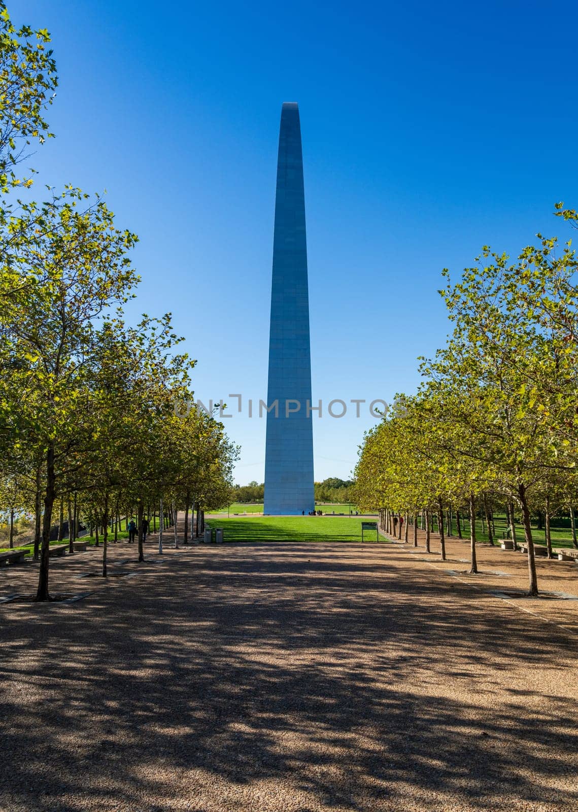 Unusual view of the Gateway arch seen from the national park on riverbank at St Louis Missouri