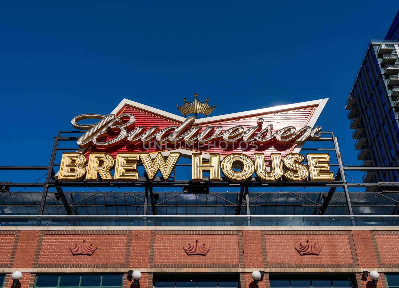 St Louis, MO - 21 October 2023: Rooftop Budweiser sign in the Saint Louis Ballpark Village dining and entertainment complex