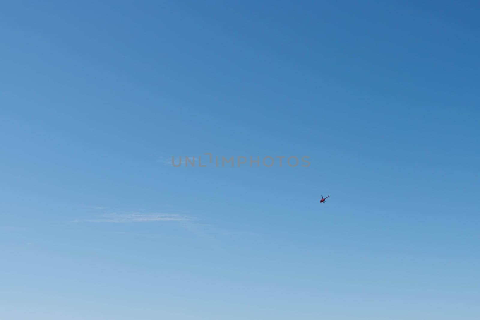 beautiful blue sky background with a small helicopter personal there is a place for an inscription. High quality photo