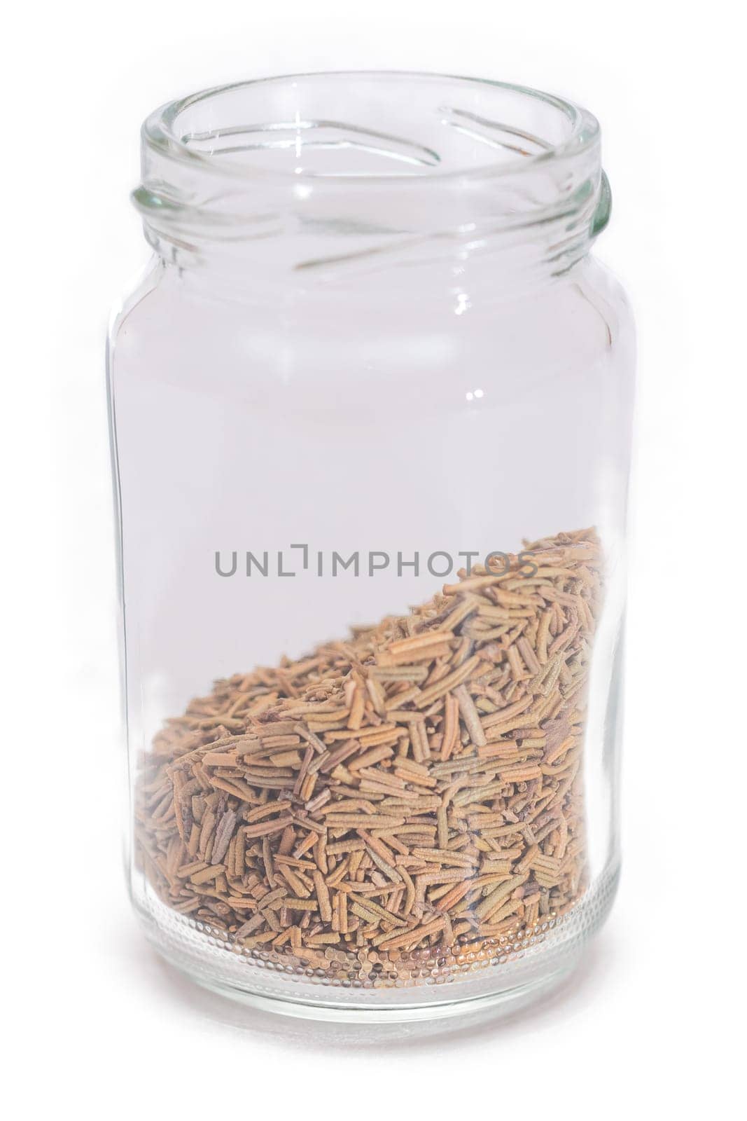 Rosemary Seasoning in a Small Glass Jar Isolated on White Background