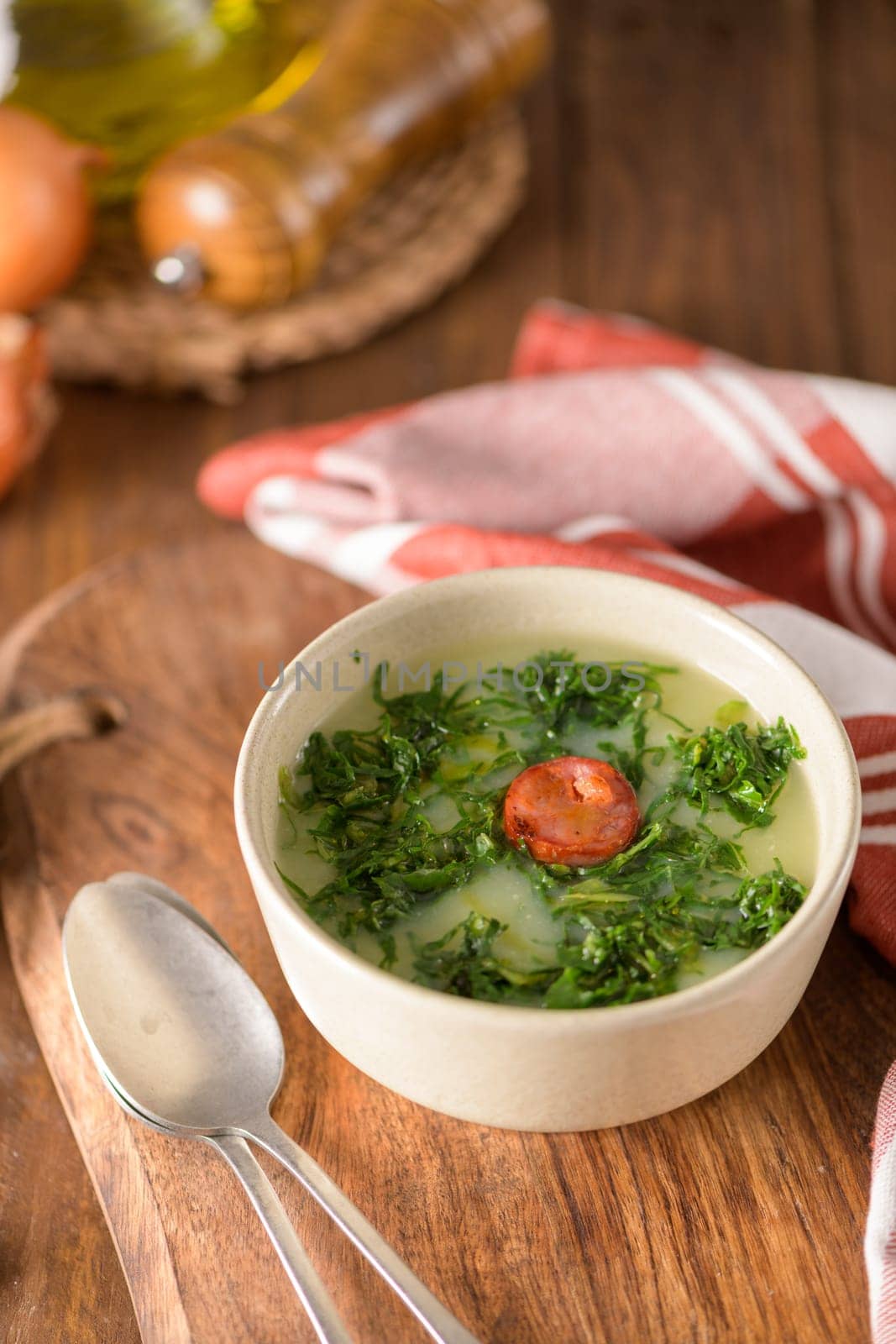 Caldo verde popular soup in Portuguese cuisine. traditional ingredients for caldo verde are potatoes, collard greens , olive oil and salt. Additionally garlic or onion may be added.