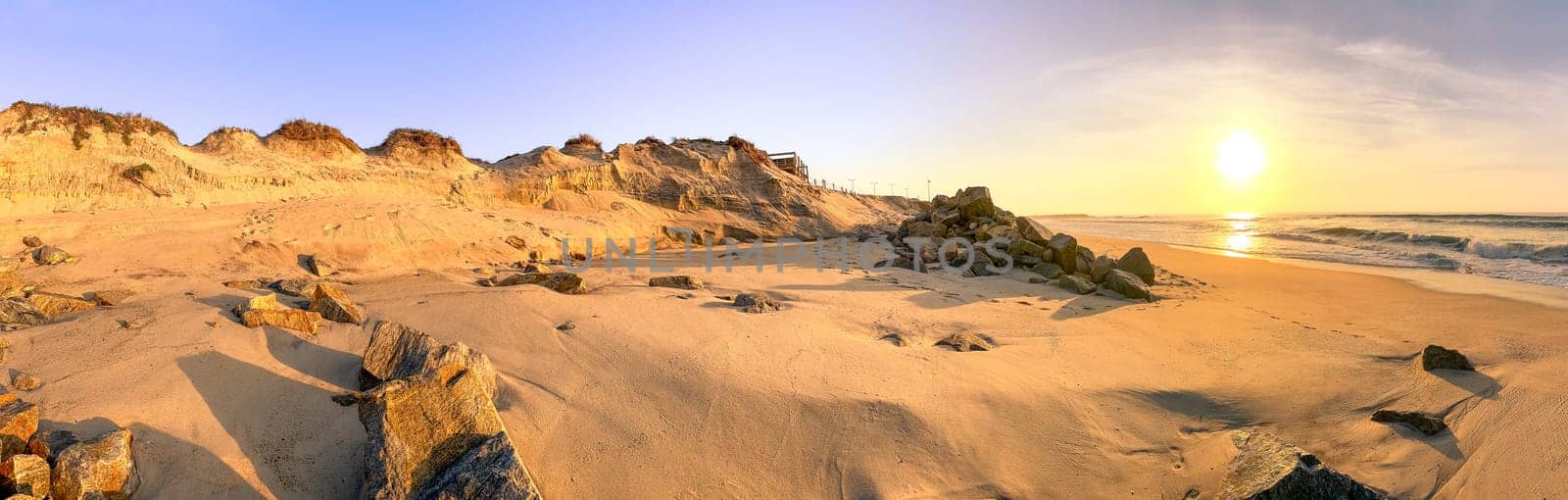 Ovar, Portugal - 25 November 2023: Damages on the dunes and rock walls on the seafront of Furadouro in Ovar. The advance of the sea due to climate change threatens Portugal.