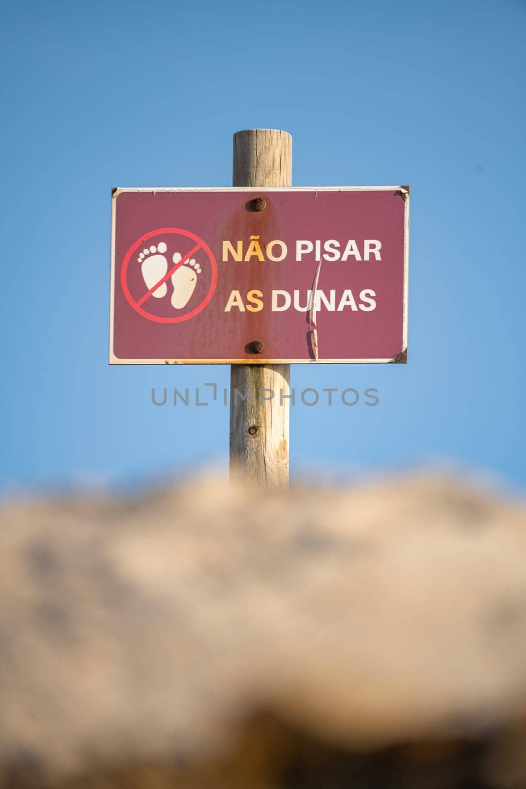 Sign prohibiting stepping on the dunes by homydesign
