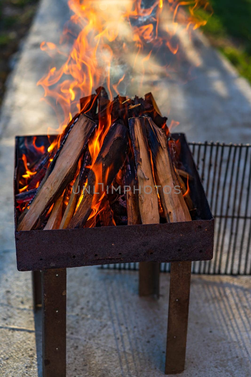 Burning wood chips to form coal. Barbecue preparation, fire before cooking.