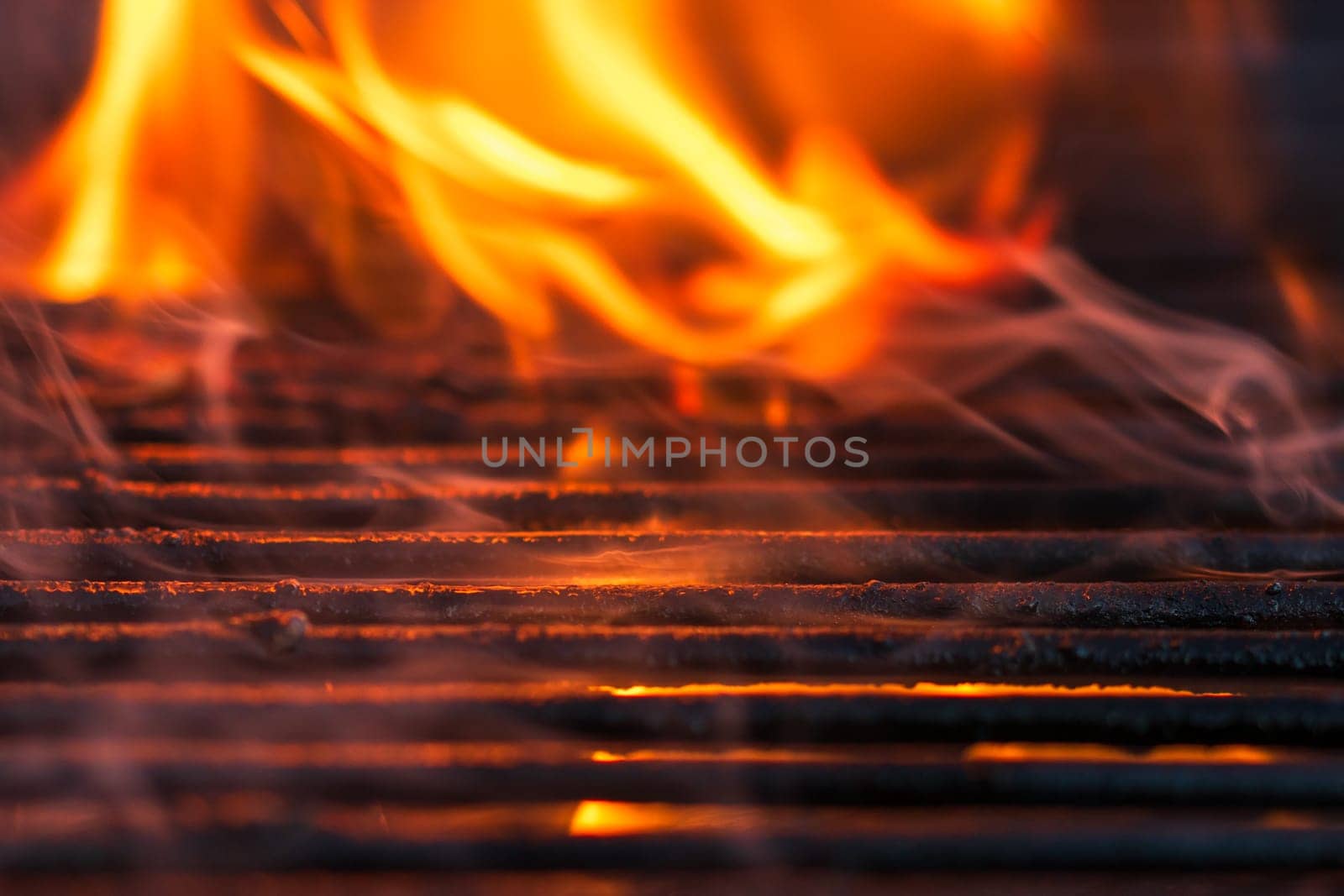 Empty hot charcoal barbecue grill with bright flame