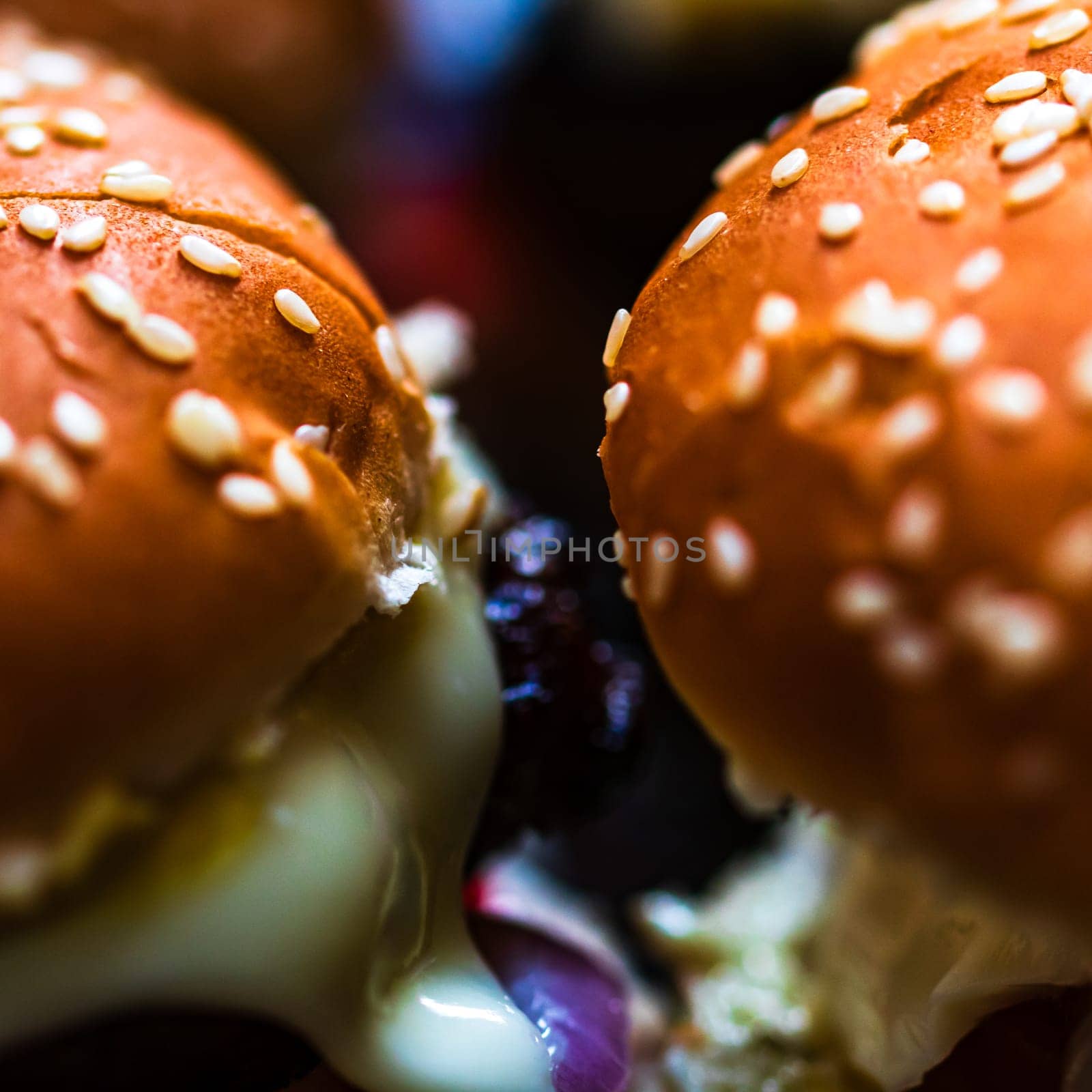 Tasty home made cheeseburger. Cheese burger with pickles, tomatoes, onion, melting cheese