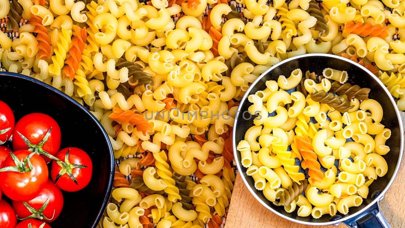 Beautiful tasty Italian pasta, tomatoes, onions and garlic for cooking pasta