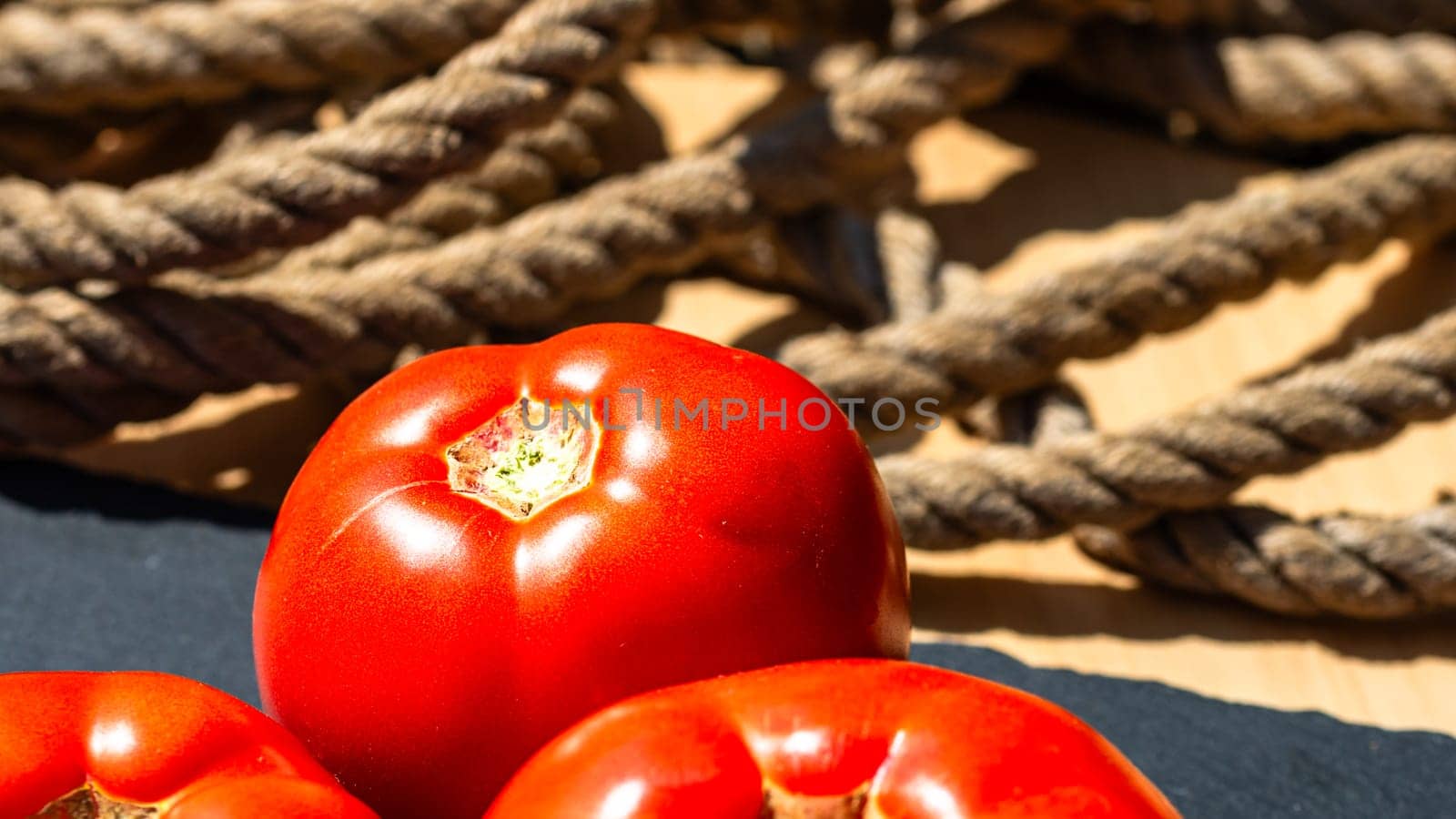 Close up of fresh ripe tomatoes isolated in a rustic composition,
