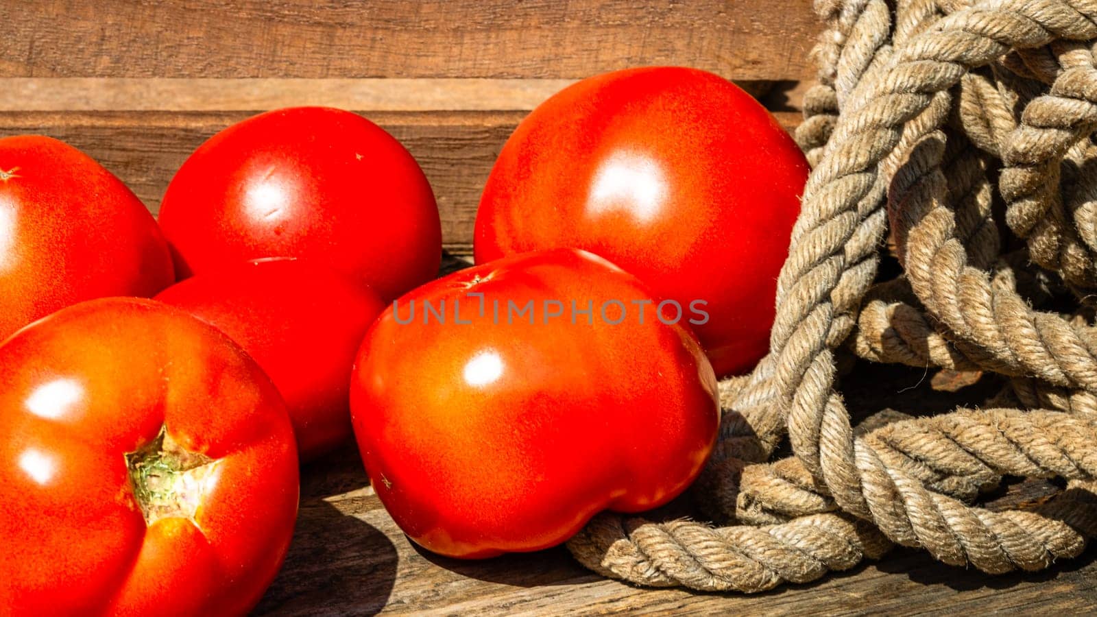 Close up of fresh ripe tomatoes isolated in a rustic composition,