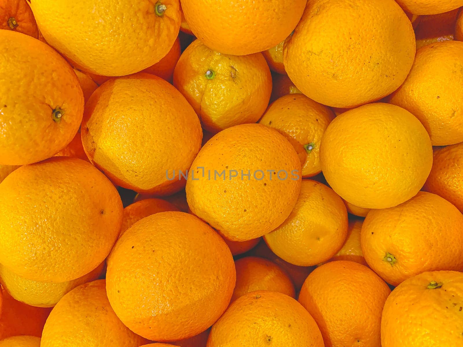 Fresh mandarin oranges texture. Macro image of lots of beautiful oranges.