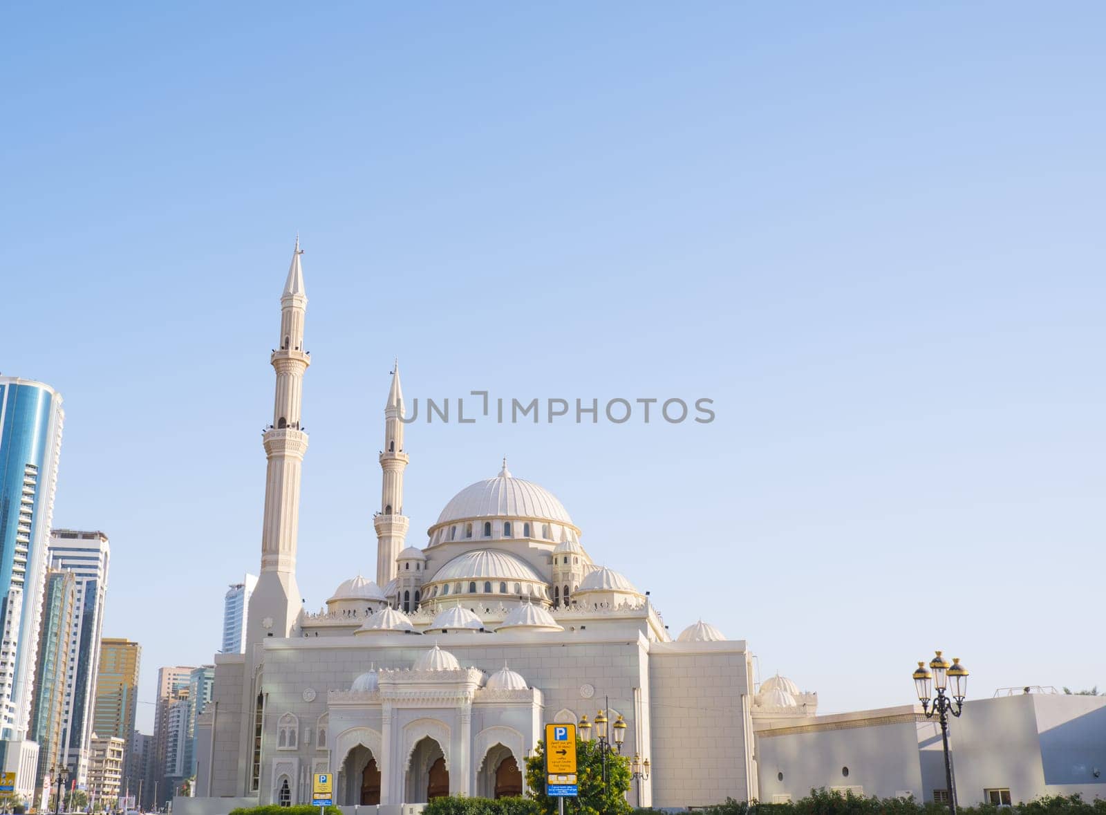 SHARJAH, UNITED ARAB EMIRATES - FEBRUARY 14, 2023: Al Noor Mosque in Sharjah near Khalid Lake on the waterfront. by Ekaterina34