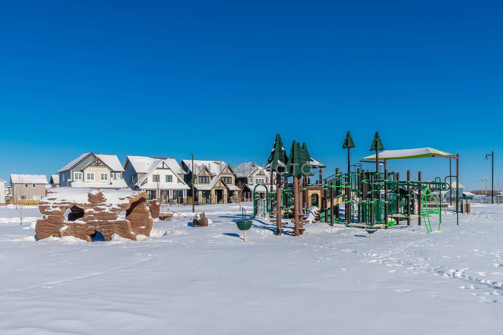 Experience the winter magic of Bear Paw Park in Saskatoon. This image captures the park's snowy landscape, frost-covered trees, and the serene beauty of a winter's day in the city.