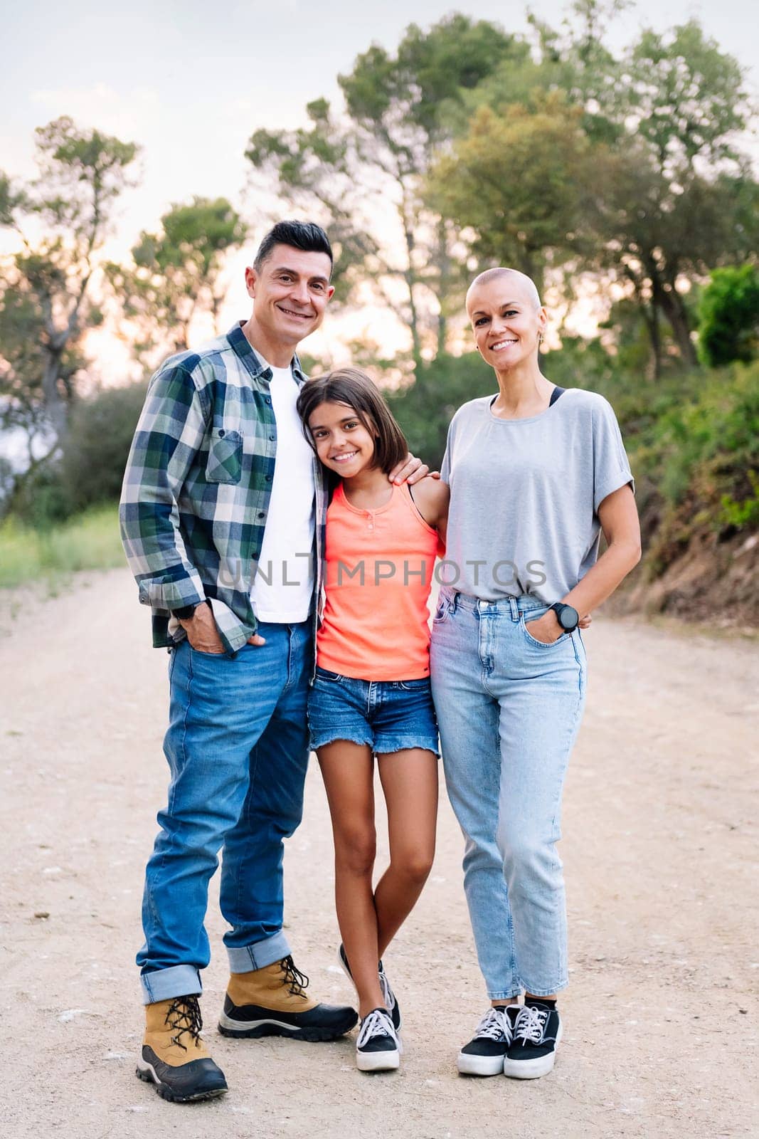 happy family smiling in the countryside by raulmelldo