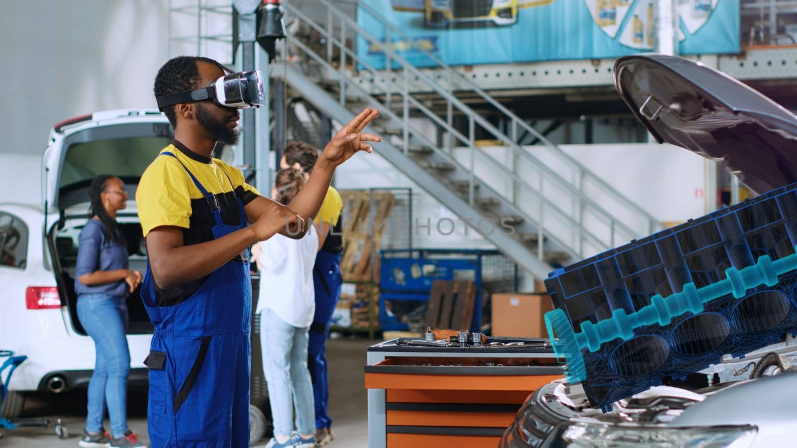 Repairman in car service using advanced virtual reality technology to visualize engine turbine in order to fix it. Knowledgeable garage specialist wearing vr glasses while servicing defective vehicle